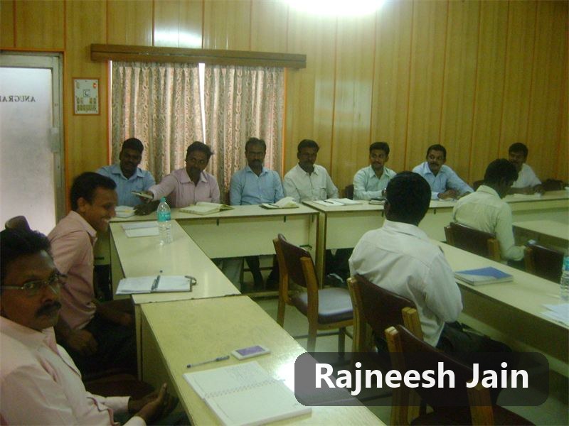 Rajneesh Jain with participants in a classroom session