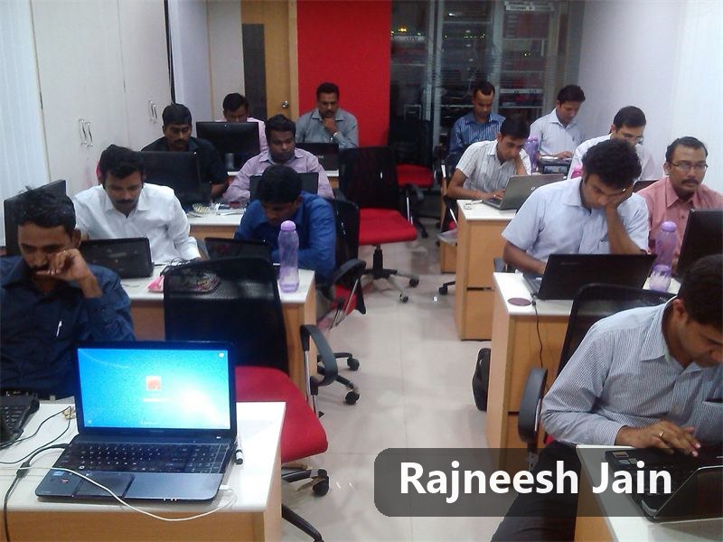Participants working on laptops in a workshop